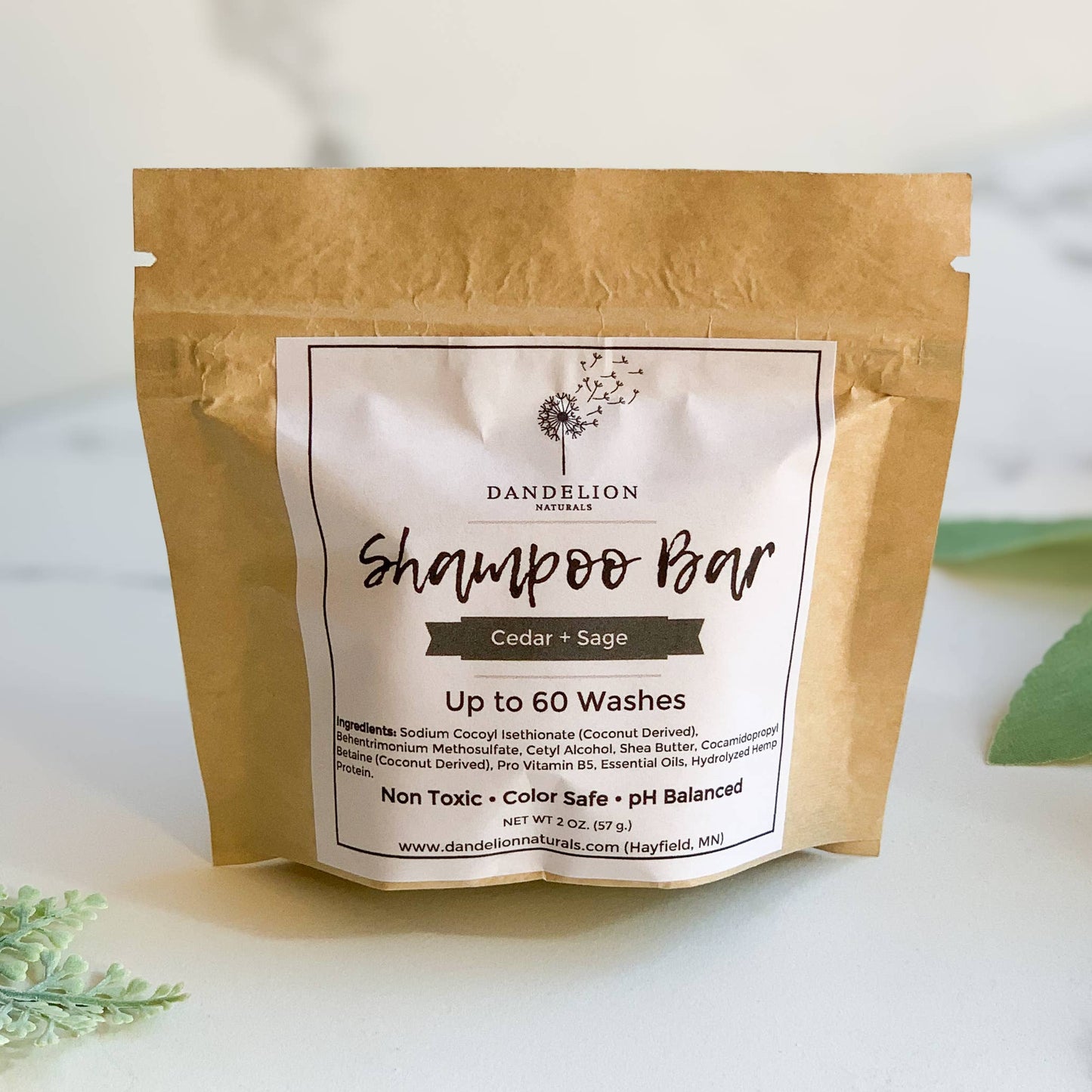 Dandelion Naturals Cedar + Sage shampoo bar in natural brown resealable pouch, eco-friendly hair care
