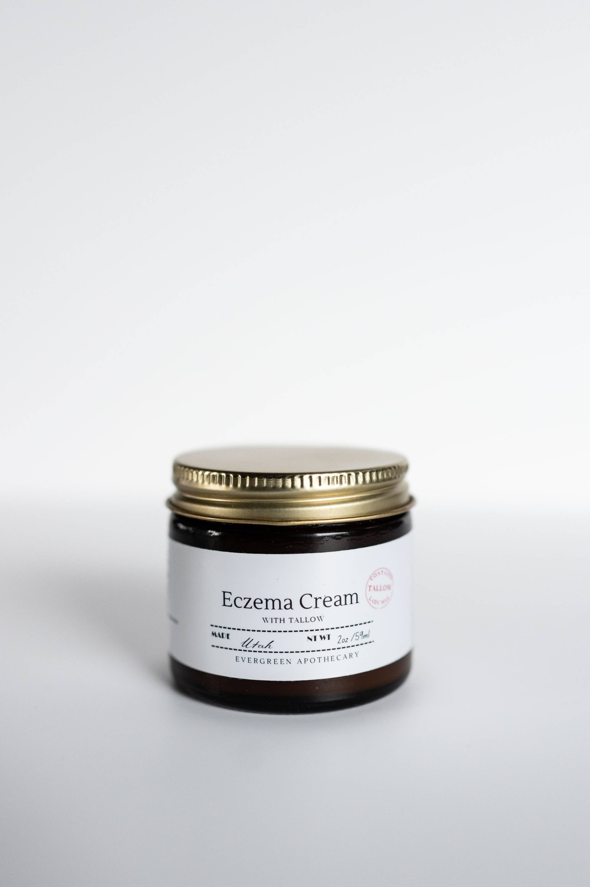 "Natural eczema cream with grass-fed tallow, licorice root, and calendula for soothing sensitive skin"
